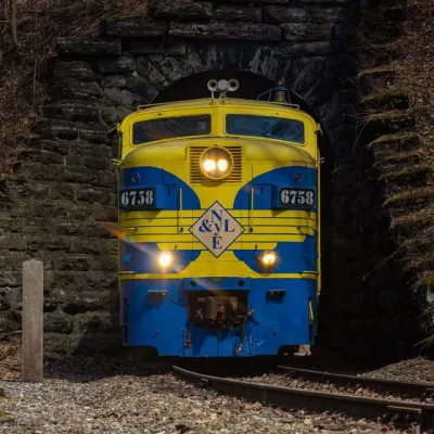 a train sitting on the side of a building