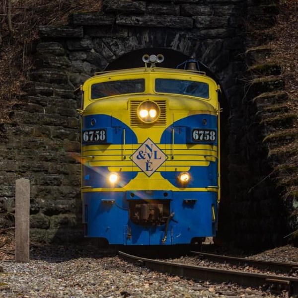 a train sitting on the side of a building