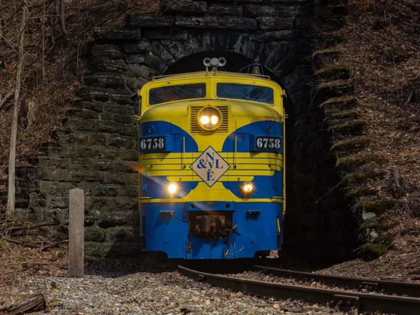 IMG_2520 a train sitting on the side of a building