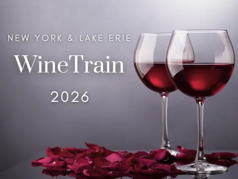 Two wine glasses on a table with rose petals, text: New York & Lake Erie Wine Train 2026.