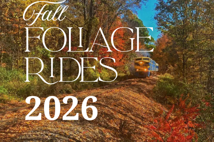 Train on forested track with autumn leaves, text: 'Fall Foliage Rides 2026'.